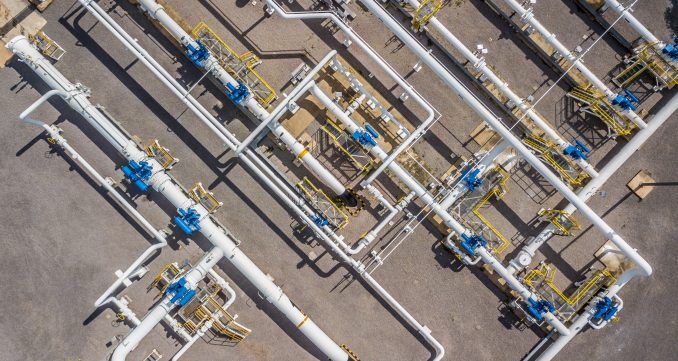Aerial top view natural gas pipeline, gas industry, gas transpor Aerial top view natural gas pipeline, gas industry, gas transport system, stop valves and appliances for gas pumping station.